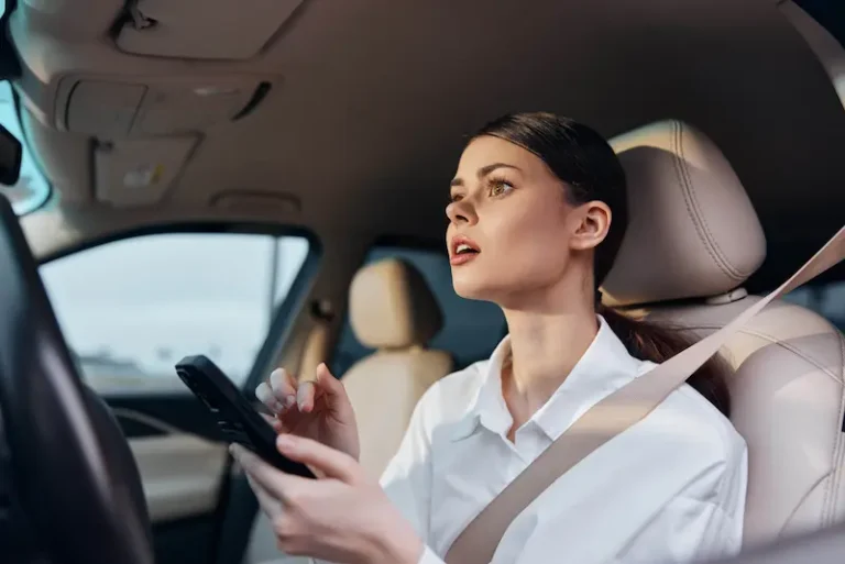 A female driver is liable for comparative negligence due to driving while distracted by her phone. Alpharetta, GA.