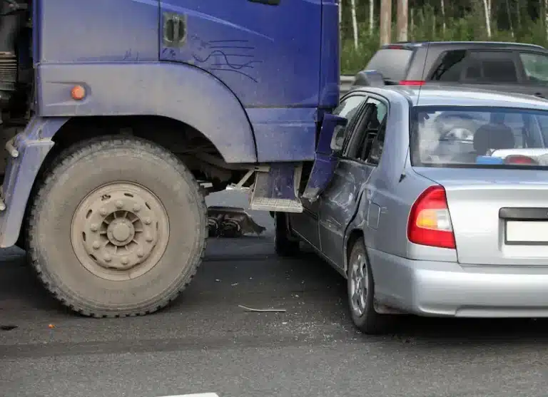 Truck accident vs car accident: a commercial truck T-bones a sedan.