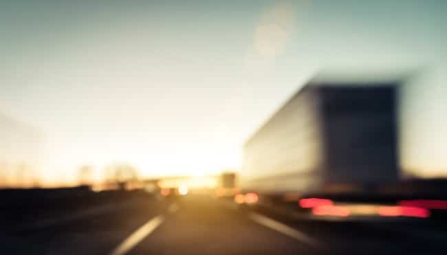Experienced Hartley Rowe Fowler truck accident attorney reviewing case evidence for injured client in Douglasville office